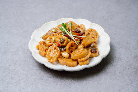 korean food yeongeunjorim, Braised Lotus Roots, Yeongeun (lotus root) parboiled and braised in a mixture of soy sauce and sugar over lower heat. Add syrup and braise to a glaze before serving.の写真素材