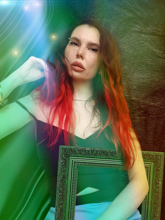 Portrait of a beautiful girl with long red hair and green frame