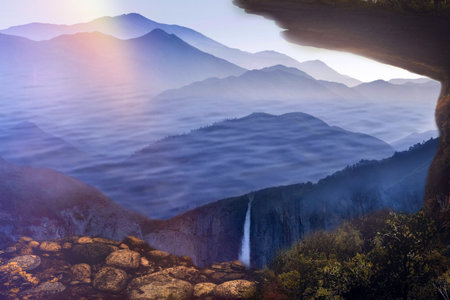 Foggy morning in the mountains. Beautiful landscape with a waterfall.の写真素材