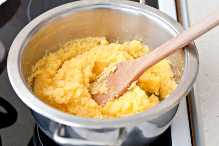 polenta corn traditional food cooking in dishの写真素材