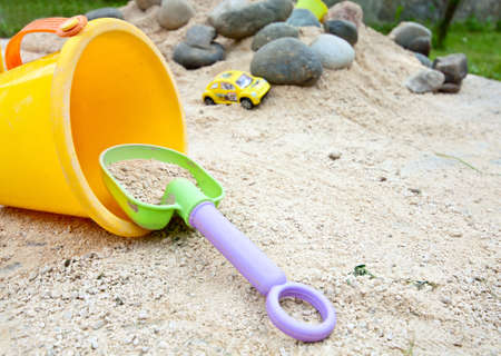 child fun play game with bucket and sandの写真素材