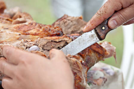 meat lamb culinary cut by hands and knifeの写真素材
