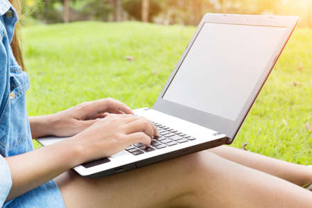 woman use laptop computer in the parkの写真素材