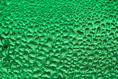 water drop on green glassの写真素材