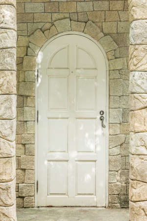 old entrance door and stone wall architect designのeditorial素材