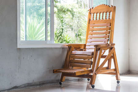 ood chair and window , loneliness concept