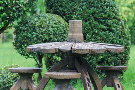 old wood chair and table decoration in gardenの写真素材