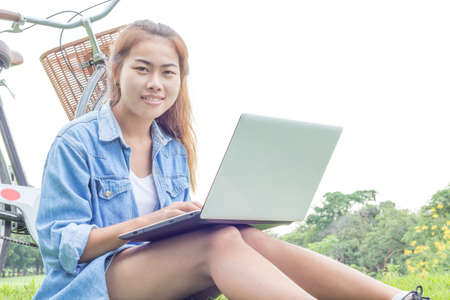 woman use laptop computer outdoorの写真素材