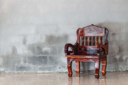 chair furniture and grunge concrete wall backgroundの写真素材