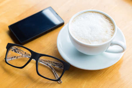 coffee cup on wood tableの写真素材