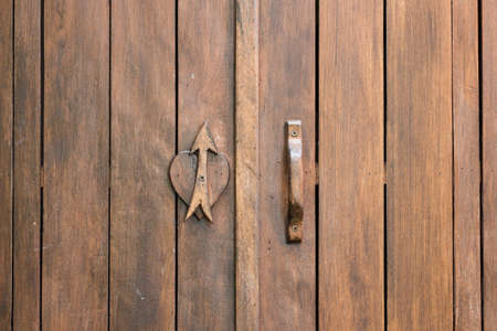love symbol on wood door backgroundの写真素材
