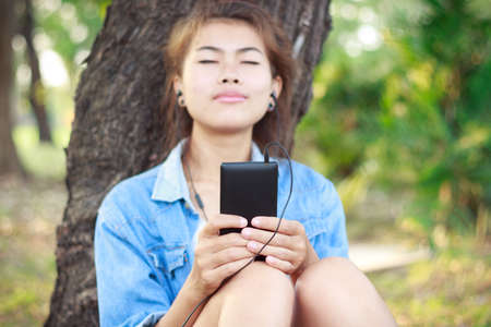 mobile take relax listen to music outdoorの写真素材