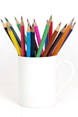 pencil coulour in coffee cup on white backgroundの写真素材