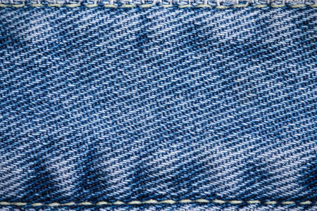 close up blue jean textured may use as backgroundの写真素材