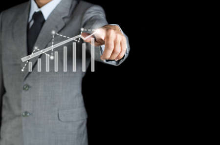 business man work with finger to strategy concept on black backgroundの写真素材