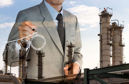 double exposure strategy business man drawing gear graph and factory backgroundの写真素材