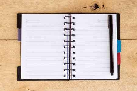 book note blank on wood backgroundの写真素材