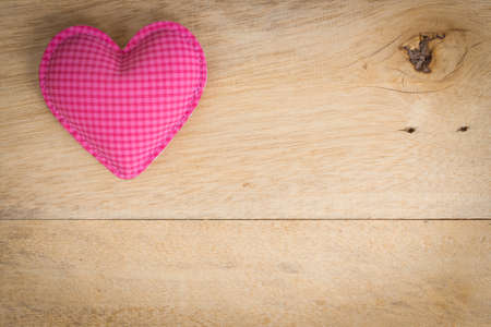 pink heart love symbol on wood backgroundの写真素材