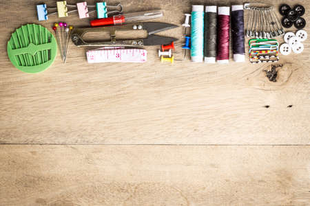 Sewing tools equipment space for sample text wood backgroundの写真素材