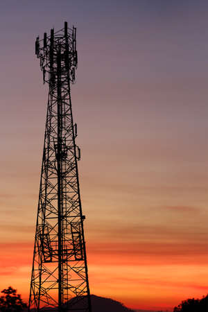 silhouette communication tower telecoms at sunsetの写真素材