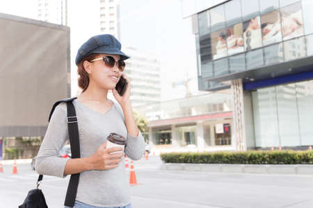 smile women talking cellphone urban lifestyle conceptの写真素材