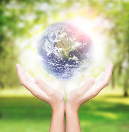 hand hold earth environment concept element finished by nasaの写真素材