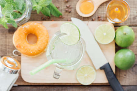 lemonade in glass on wood tableの写真素材