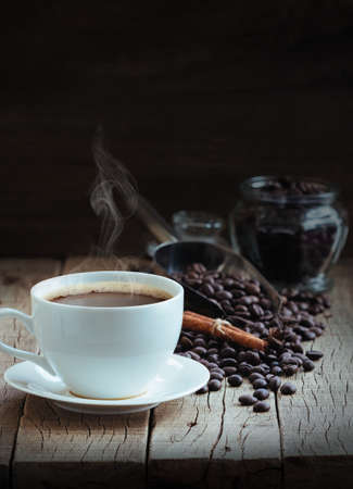 hot coffee and beans on wood backgroundの写真素材