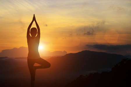 silhouette of yoga woman healthy lifestyleの写真素材