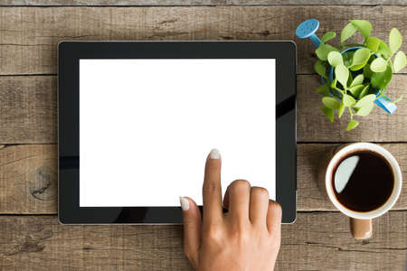 hand using tablet on top viewの写真素材