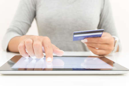 woman using tablet and credit card pay shopping onlineの写真素材