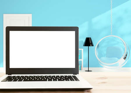 laptop computer white screen on wood deskの写真素材