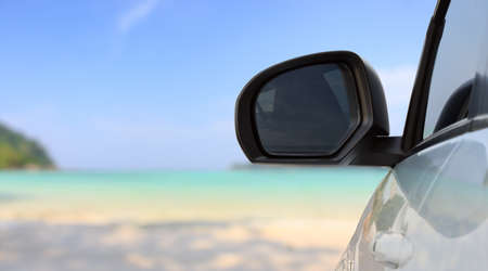traveling car on bright beachの写真素材