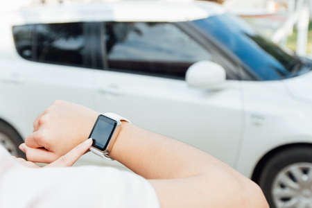 female hand touching on smartwatchの写真素材