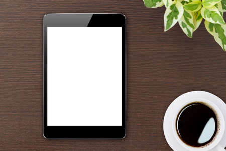 digital tablet blank screen on wood top viewの写真素材