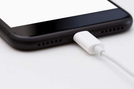 Bangkok, Thailand - October 28, 2016: close-up iphone 7 selective focus on usb cable connect, new iPhone 7 is manufactured by apple Inc.のeditorial素材