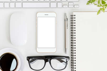 phone mobile blank screen on work table top view, mock-up new smartphone gold color clean and easy adjustmentの写真素材