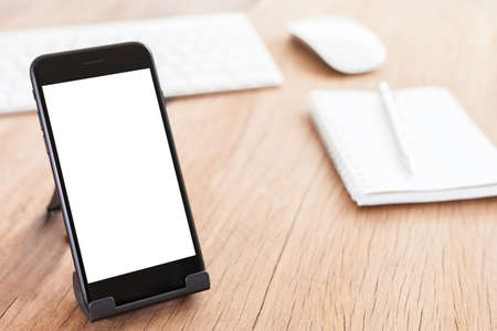 close-up phone mobile blank white screen on holderの写真素材