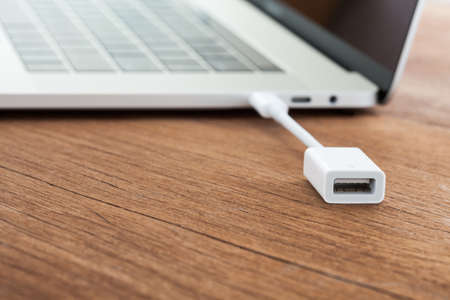 close-up cable data convert to laptop computer new modern technology transfer connectの写真素材