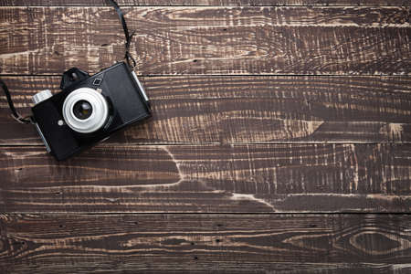 old camera film on wood background with copy space