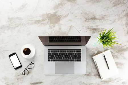 laptop computer on table workspace top viewの写真素材