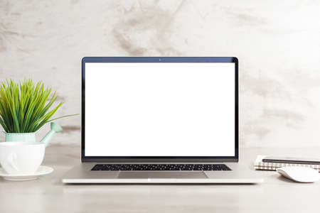 laptop computer white blank screen on work table front viewの写真素材