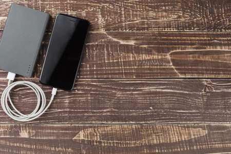smart phone mobile connect to power bank on top viewの写真素材