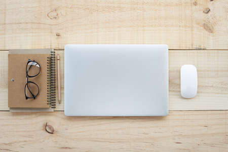 laptop computer on work table top viewの写真素材