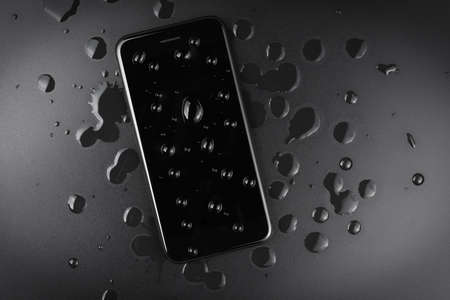 water drop on samartphone mobile on top view, waterproof phone conceptの写真素材