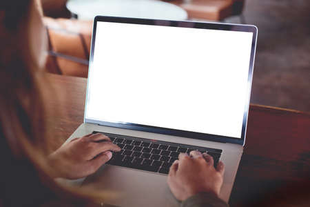 close-up woman typing laptop computer rear viewの写真素材