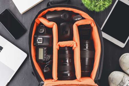 camera gear in bag on top view ready to go travel conceptの写真素材