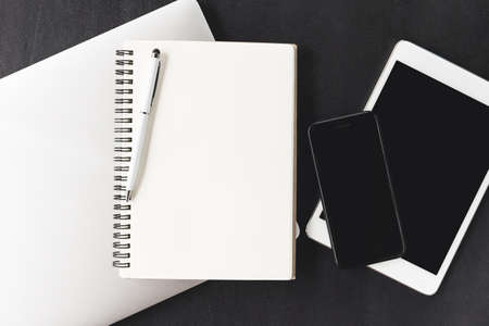 notebook blank page stack on laptop computer