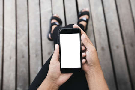 woman sitting and using phone outdoor lifestyle