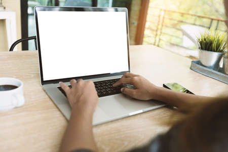 close-up waoman typing on laptop keyboard on desk